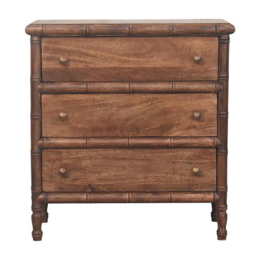Commode en manguier massif amande grillée, encadrement sculpté façon bambou, trois tiroirs à boutons laiton