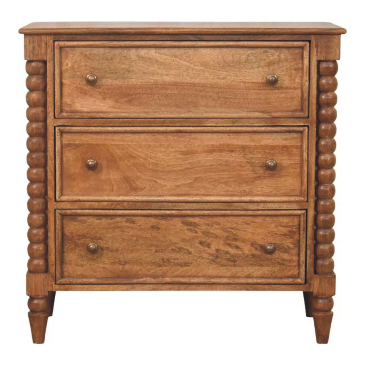 Commode en manguier massif teinte ambre, trois tiroirs à boutons ronds et pieds bobine sculptés